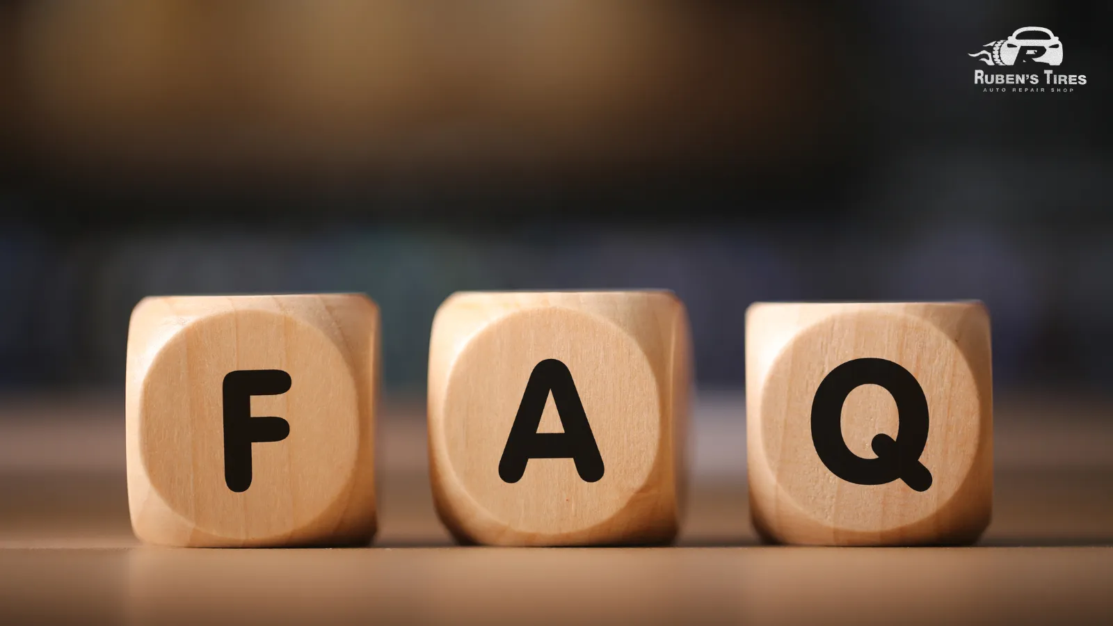 Wooden blocks spelling 'FAQ' related to oil changes at Ruben's Tires in North Semoran.