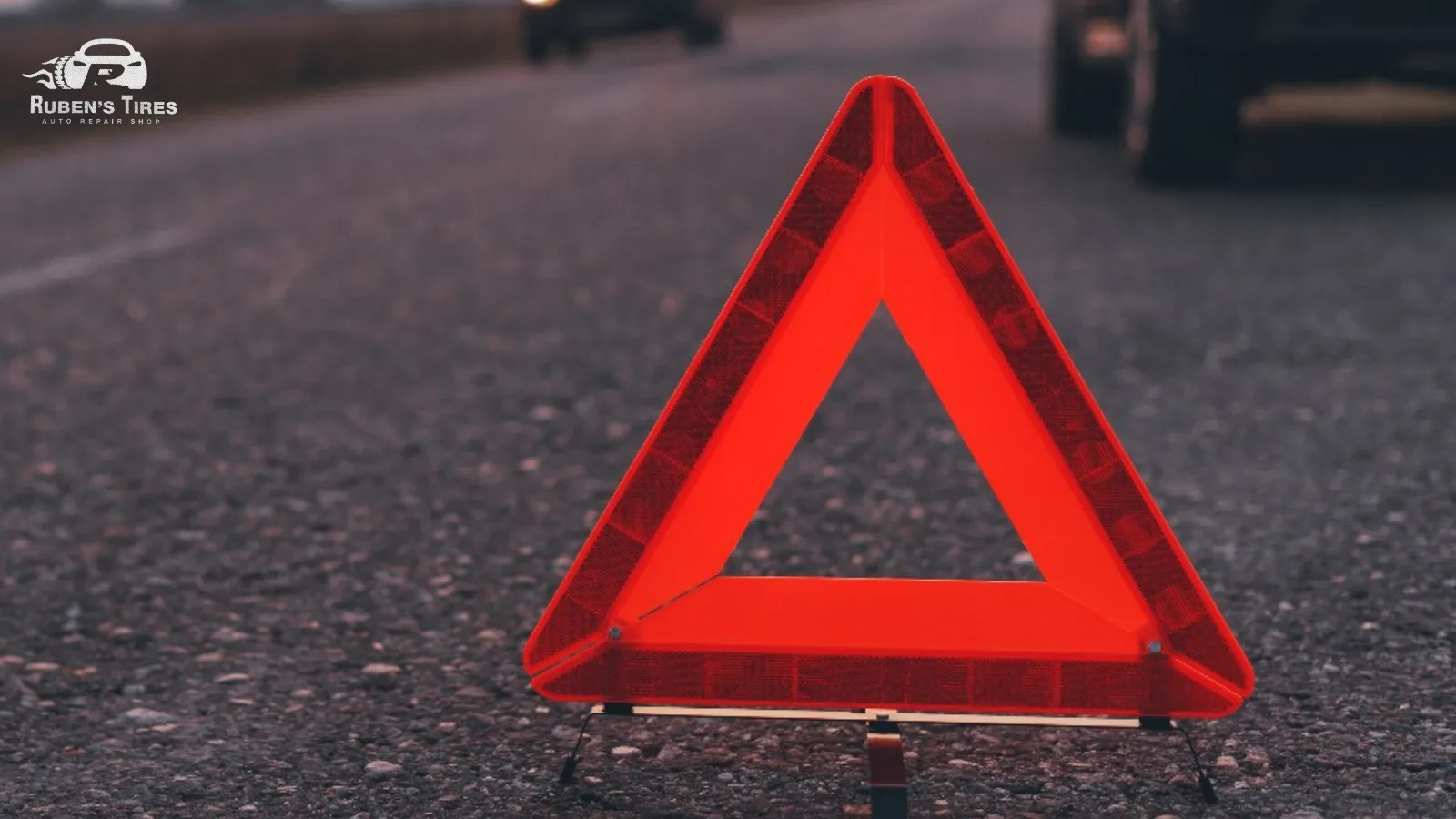 Emergency warning triangle displayed on the road, emphasizing the importance of suspension repair in North Semoran.