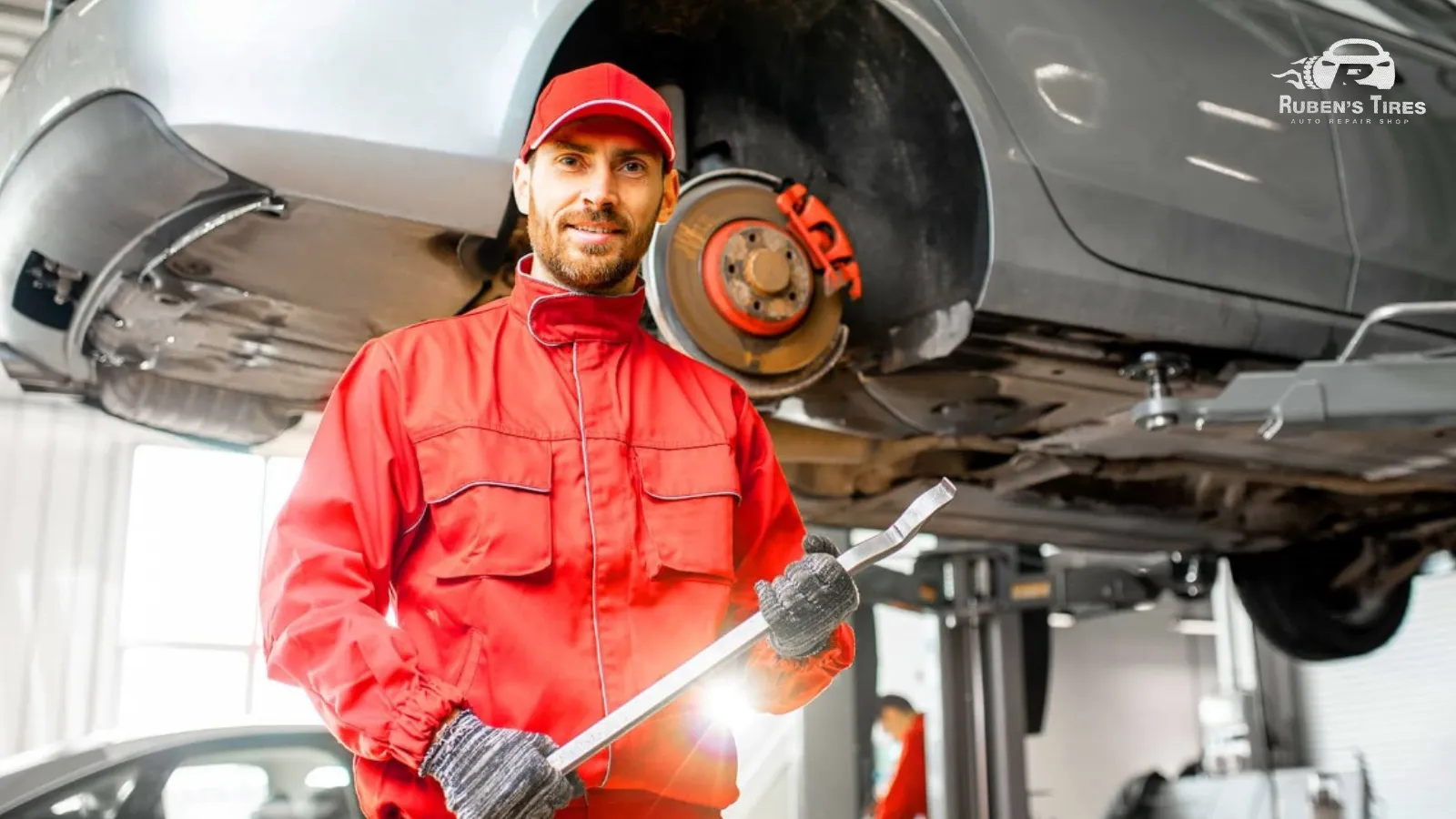 Experienced technician working on a car's suspension system at Ruben's Tires, North Semoran.